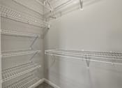 Thumbnail 36 of 38 - Empty shelves in a white refrigerator.