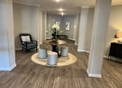 Thumbnail 1 of 15 - a room with a table and chairs in the middle of it