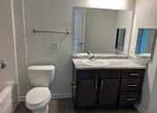 Thumbnail 3 of 15 - a bathroom with a toilet sink and bathtub