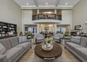 Thumbnail 4 of 38 - A living room with a balcony and a coffee table.