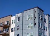 Thumbnail 2 of 10 - A modern building with the number 2247 on it.