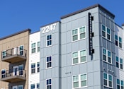 Thumbnail 8 of 10 - A tall building with the number 2247 on it.
