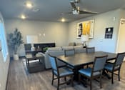 Thumbnail 5 of 9 - A modern interior with a wooden wall and a white table.
