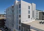 Thumbnail 2 of 13 - A white building with the words "MADISON PREYNOLDS" on the side.