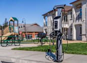 Thumbnail 20 of 53 - A charging station for electric vehicles is located in a park.