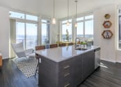 Thumbnail 21 of 24 - an open kitchen with a large island and a view of the city at Napoleon Apartments, Washington, 98402