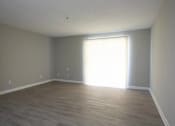Thumbnail 10 of 20 - A room with light coming through a window at The Madison Apartments and Townhomes, Lawrenceville, 30044