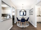 Thumbnail 8 of 27 - A modern dining room with a round table and chairs at Barcelo at East Cobb Apartments, Marietta, GA