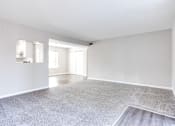 Thumbnail 9 of 27 - A spacious room with a grey carpet and white walls at Barcelo at East Cobb Apartments, Marietta