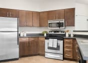 Thumbnail 14 of 44 - Chef-Inspired Kitchens Feature Stainless Steel Appliances at Mosaic on the River Apartments, Washington, 99352