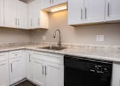 Thumbnail 1 of 60 - a bathroom with a sink and a mirror at Cleo Apartments, Alabama, 35611