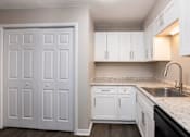 Thumbnail 58 of 60 - a white kitchen with  at Cleo Apartments, Alabama, 35611