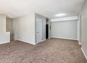 Thumbnail 5 of 60 - an empty room with a carpet and walls at Cleo Apartments, Alabama, 35611