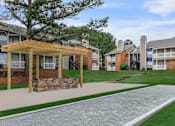 Thumbnail 4 of 16 - community with a walkway and grass at The Davis Apartments, Huntsville Alabama  