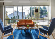 Thumbnail 13 of 57 - a living room with a couch and two chairs at Jefferson Yards, Washington, 98402