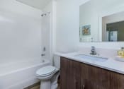 Thumbnail 24 of 57 - a bathroom with a sink toilet and bathtub at Jefferson Yards, Tacoma Washington