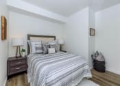 Thumbnail 40 of 57 - a bedroom with a bed and two night stands at Jefferson Yards, Washington