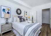 Thumbnail 38 of 57 - a bedroom with a bed and two night stands at Jefferson Yards, Tacoma Washington