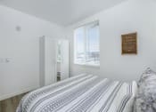Thumbnail 37 of 57 - a bedroom with a large bed next to a window at Jefferson Yards, Tacoma, 98402