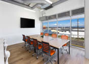 Thumbnail 31 of 57 - a conference room with a large window and a flat screen tv at Jefferson Yards, Tacoma Washington