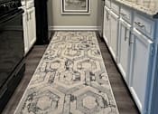 Thumbnail 6 of 22 - A kitchen with a black fridge and a rug on the floor.