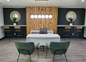 Thumbnail 1 of 22 - Two green chairs are in front of a white table.