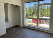Thumbnail 19 of 28 - Living Area With Balcony at Commons on the Tualatin River, Tualatin, OR, 97062