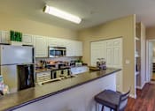 Thumbnail 7 of 48 - Island Kitchen at Commons at Verandas in Tanasbourne Apartments, Oregon, 97124