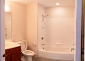 Thumbnail 17 of 17 - a bathroom with a toilet sink and bathtub