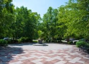 Thumbnail 6 of 17 - a fountain in the middle of a park