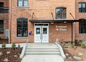 Thumbnail 27 of 27 - The front of a building with a sign that says Tremont @ Flats.