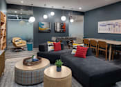 Thumbnail 3 of 28 - a living room with couches and chairs and a table