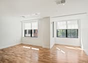 Thumbnail 24 of 33 - living room with white walls and wood floors