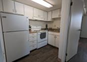 Thumbnail 21 of 21 - a kitchen with white appliances and white cabinets