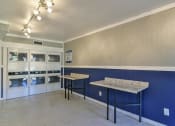 Thumbnail 15 of 15 - a laundry room with two tables and two refrigerators