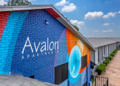 Thumbnail 9 of 15 - A colorful building with the words