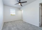 Thumbnail 4 of 6 - an empty room with a ceiling fan and a window