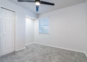 Thumbnail 3 of 6 - an empty room with white walls and a ceiling fan
