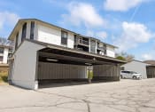 Thumbnail 20 of 25 - a garage with a car parked in front of it