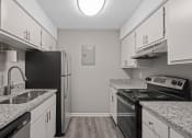 Thumbnail 1 of 25 - apartment kitchen with granite counter tops and black appliances