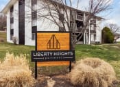 Thumbnail 17 of 25 - a sign in front of a library heights apartments building