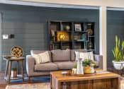 Thumbnail 4 of 27 - a living room with a couch and a coffee table