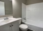 Thumbnail 14 of 14 - bathroom with toilet, vanity, and full tub