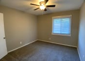 Thumbnail 11 of 14 - carpeted bedroom with large closet and ceiling fan