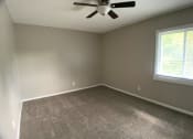 Thumbnail 9 of 14 - carpeted bedroom with large closet and ceiling fan