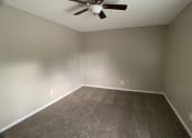 Thumbnail 8 of 14 - carpeted bedroom with large closet and ceiling fan