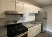 Thumbnail 4 of 14 - kitchen with cabinets and stainless steel appliances