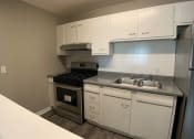 Thumbnail 5 of 14 - kitchen with cabinets and stainless steel appliances