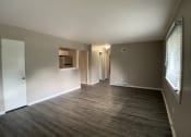 Thumbnail 1 of 14 - large living room with vinyl plank flooring and breakfast bar