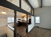Thumbnail 11 of 26 - the view from the living room into the kitchen and dining room
